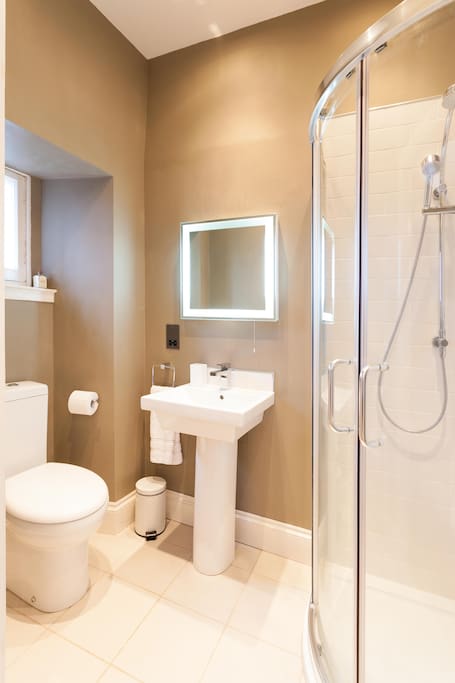 Master bedroom ensuite, with shower, sink and toilet with view across the Pentlands!