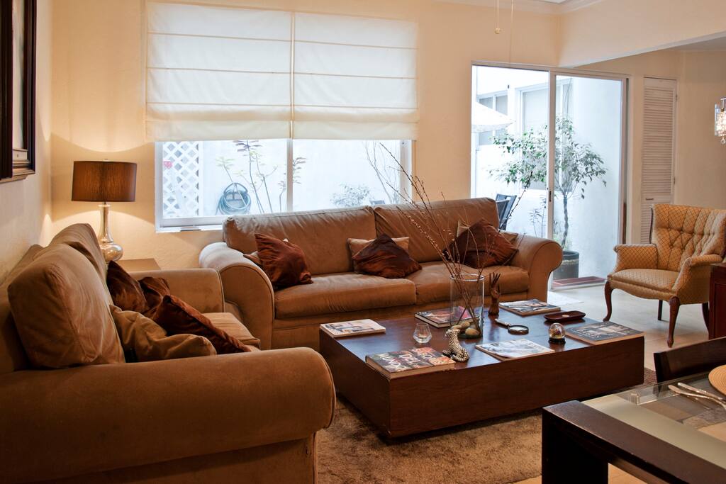 Livingroom with large windows and patio view.