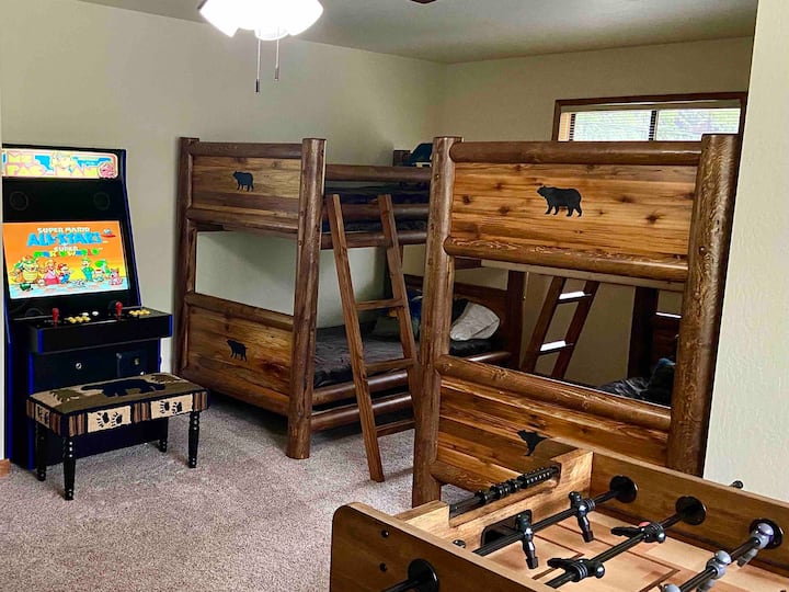 Fun fun fun kids room! It’s got two custom built in full-sized beds and two, twin over twin bunk beds! This room also has a foosball table and an upright arcade game with 3000 games on it!!!