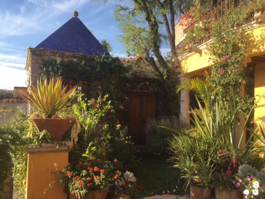 Private entrance to property. Alongside is dedicated Hemmingway writing room with a bottle of rum and window view of San Miguel.