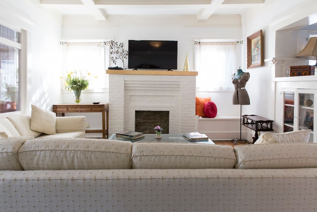 Living room with window seat and built in cabinets (Now with new air conditioning).