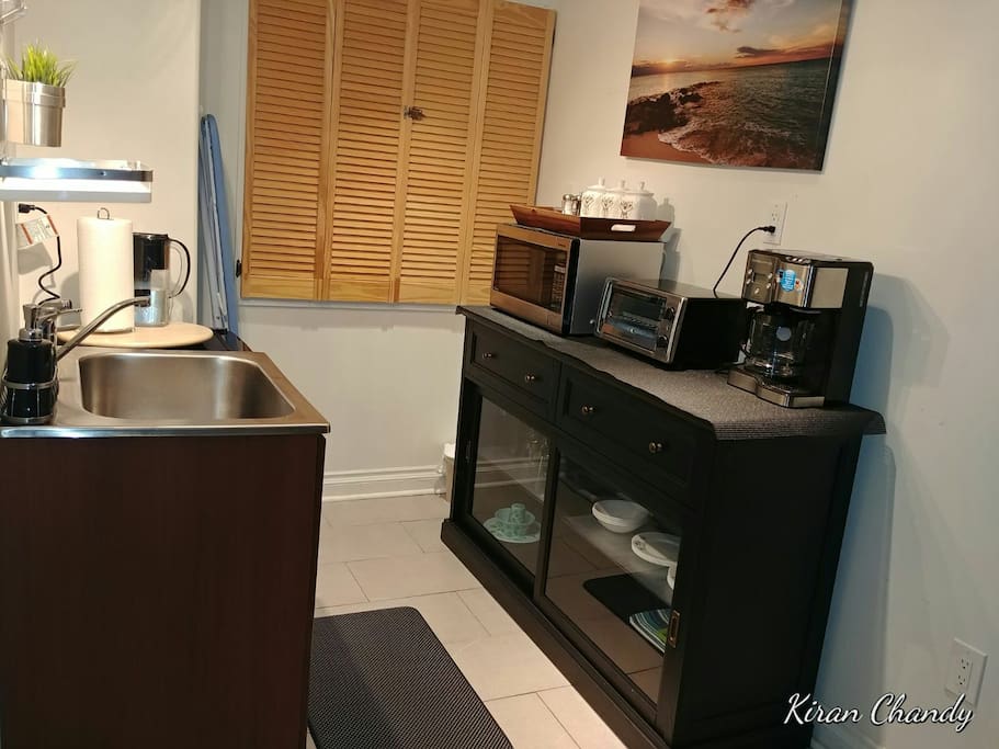 Kitchenette equipped with fridge, Microwave, Oven, Coffee maker, Dishes, Cutlery