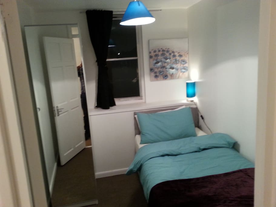 Room showing Wardrobe with Full Length Mirror .