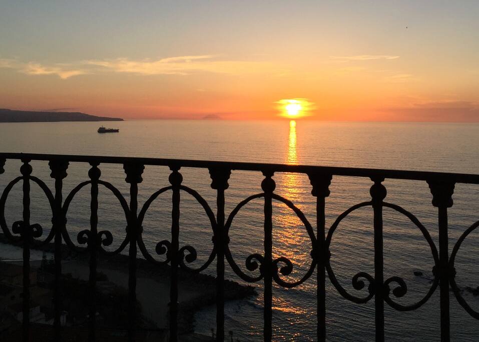 sunset with volcano Stromboli seen from the balcony