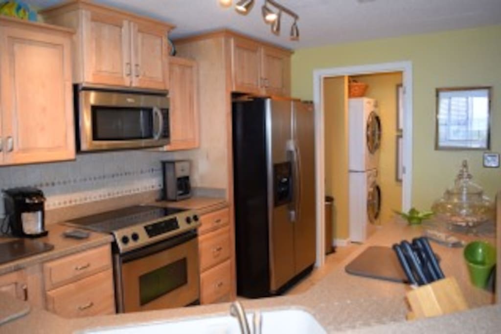 Renovated, fully-equipped kitchen with stainless appliances overlooking the Gulf