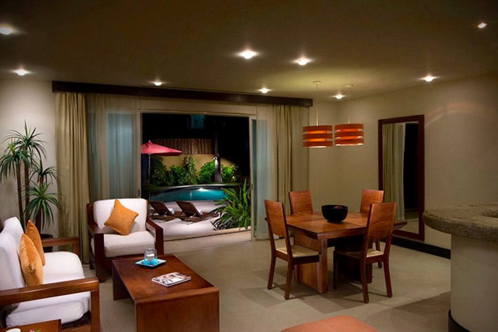 the living room with a fold out couch and another mattress