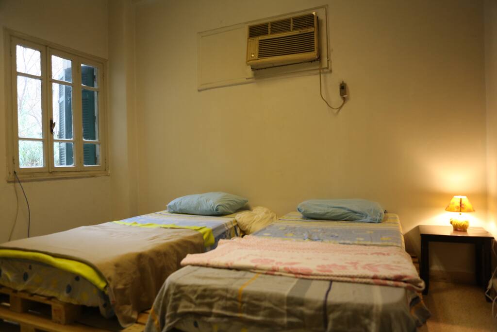 your bedroom is consisting of 2 beds they can be one king size bed beside the window