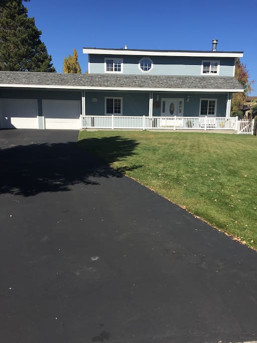 Front view of The Lake House. Covered front porch for morning coffee or evening wine. Parking for 4 cars.