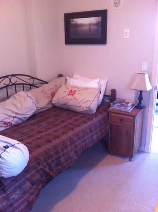Your room. Single bed, but there are two mattresses so you can sleep one person on the floor. I've been told its very comfy!