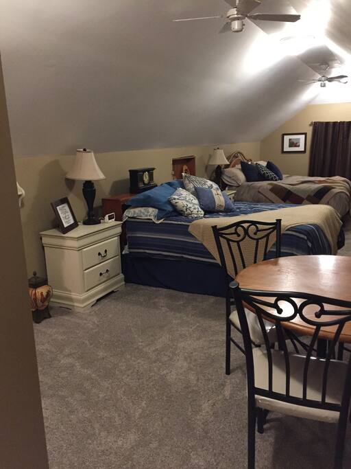 The beds have down comforters on them. The king bed has a pillow top mattress.