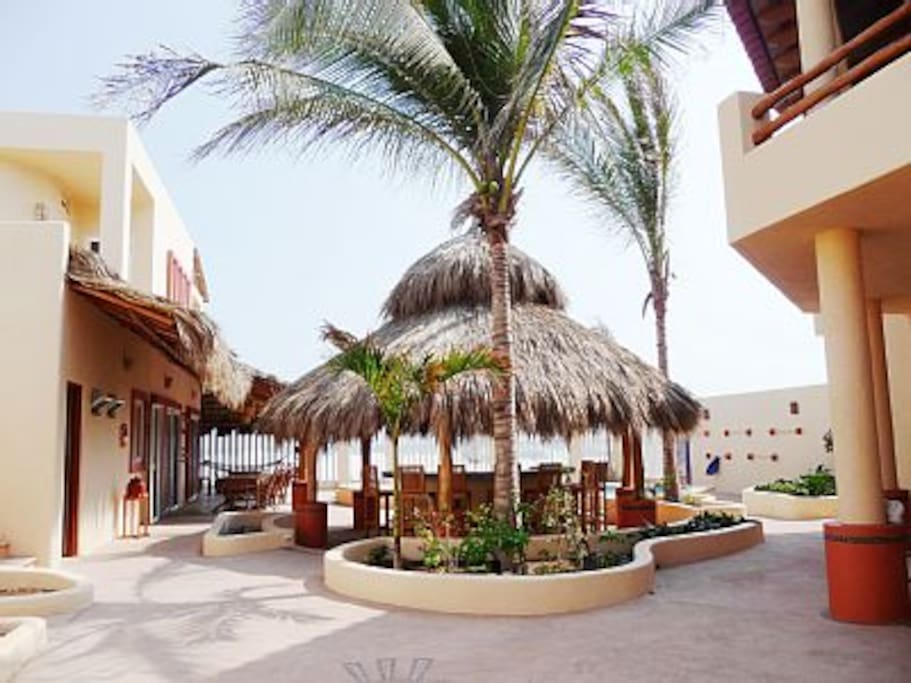 Main building, palapa bar, guest building from property entrance