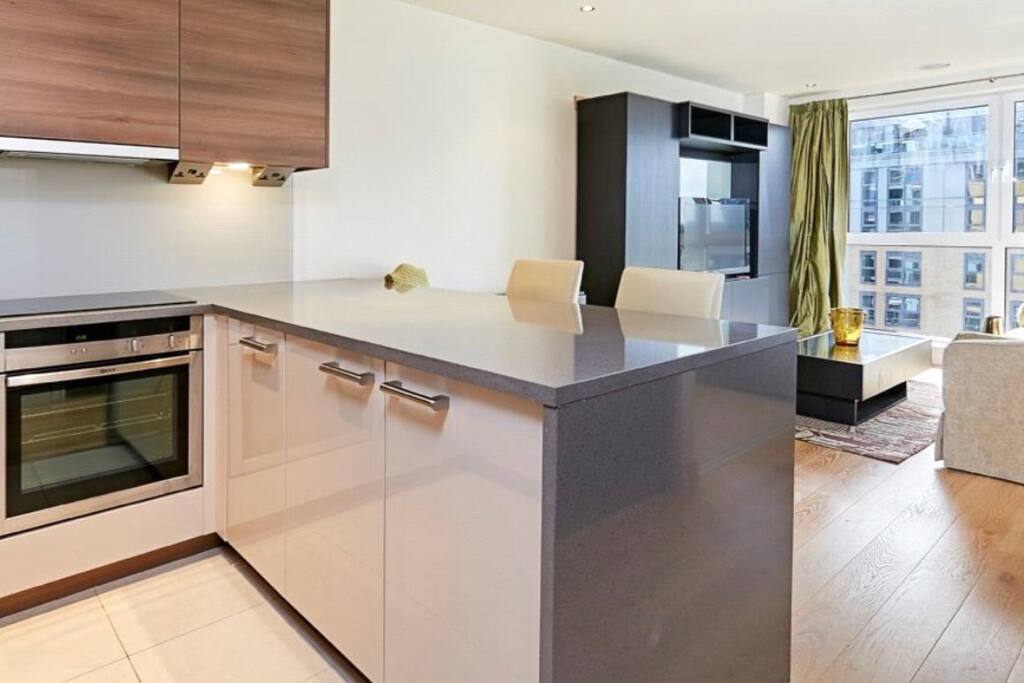 Kitchen and breakfast bar and main living area