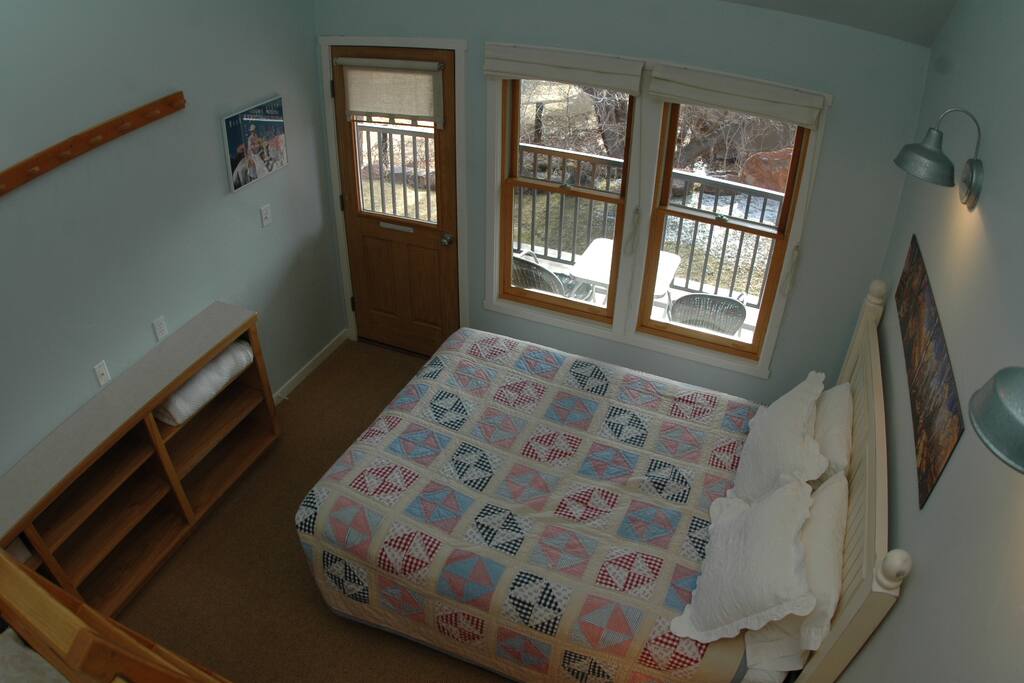 Second bedroom with one queen bed, one twin bed, and ensuite bathroom.