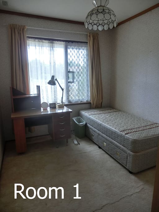 Room1, with a single bed, table.... cont->
