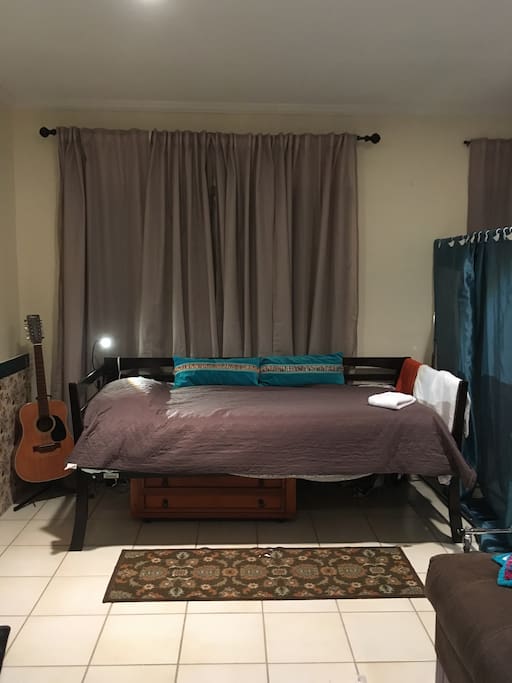 Daybed in living-room. Real Mattress, fresh linens always, night light for reading. (Old photo)