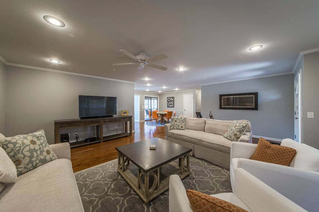 Large seating area in living room with 55" HDTV.
