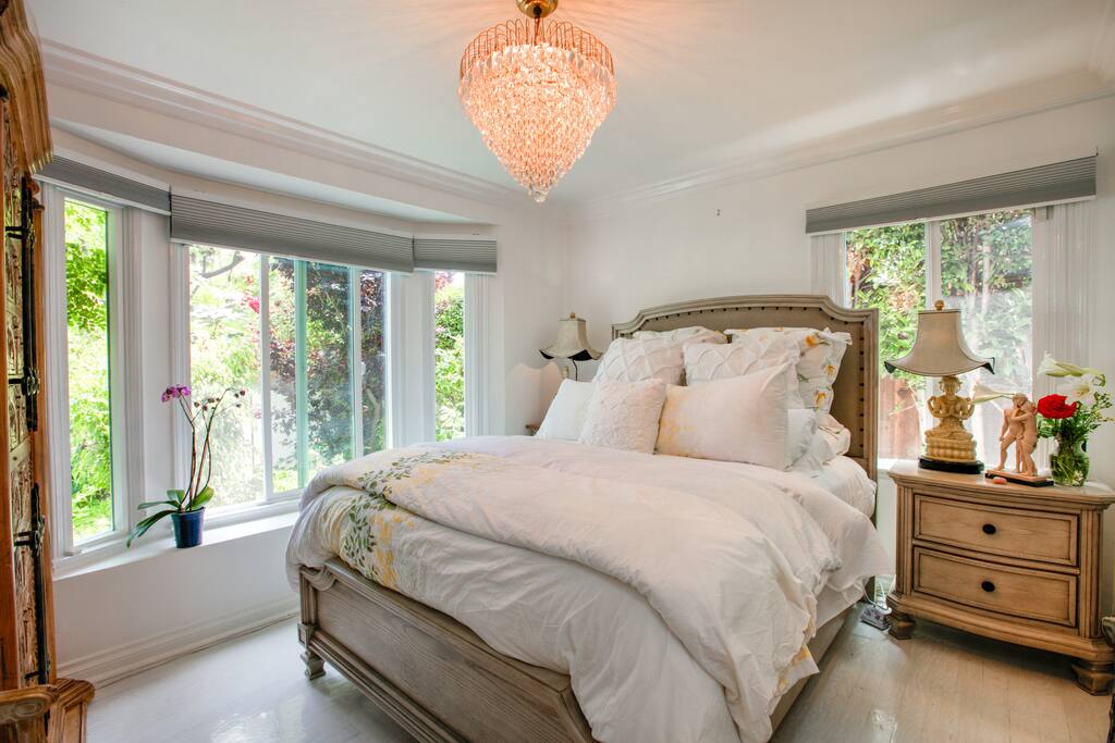 Sophisticated and classy, the bedroom has a queen bed outfitted in luxurious bedding.