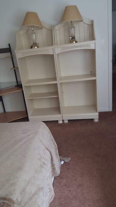 Desk and book shelves which could be use for clothes.