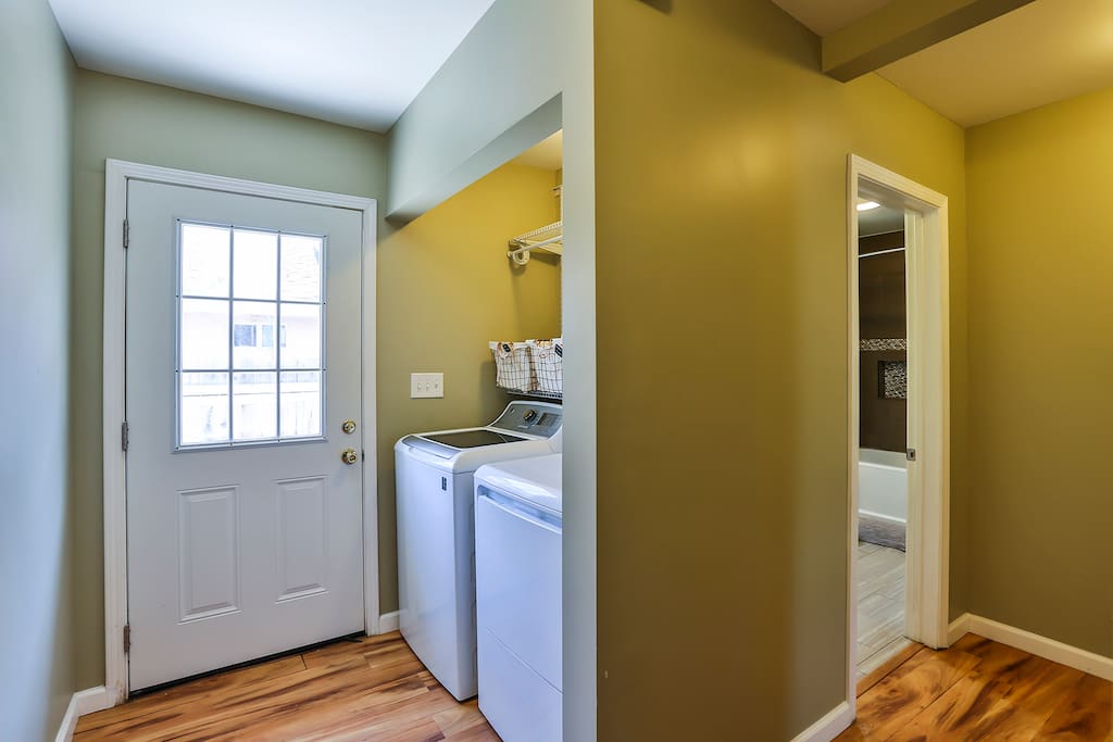 Laundry room and hallway that separates the front 2 bedrooms from the master bedroom for added privacy.