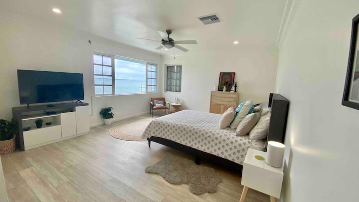 Primary bedroom w/ 52" TV