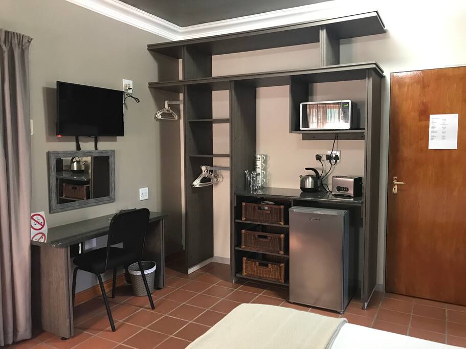 Workspace, kitchenette and cupboard