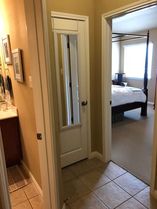 The room has its own little “foyer” area separate and semi private from the rest of the house. The bathroom is right across the little hallway.