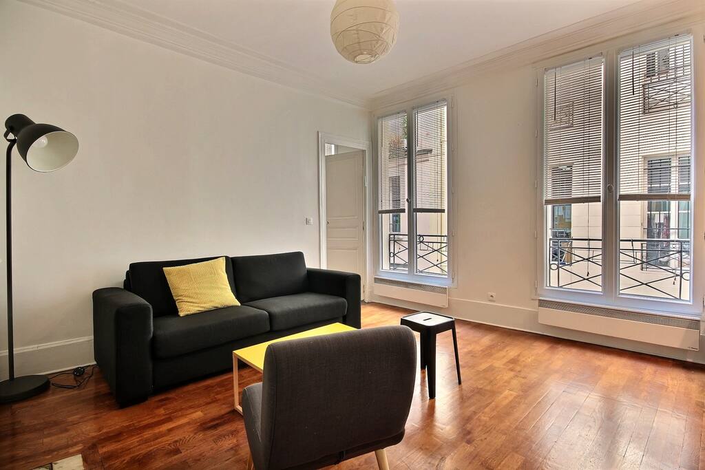 Luminous living room with sofa and TV