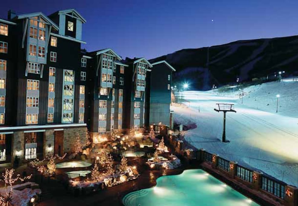 night view of the ski in ski out and pool area off of the main PC run