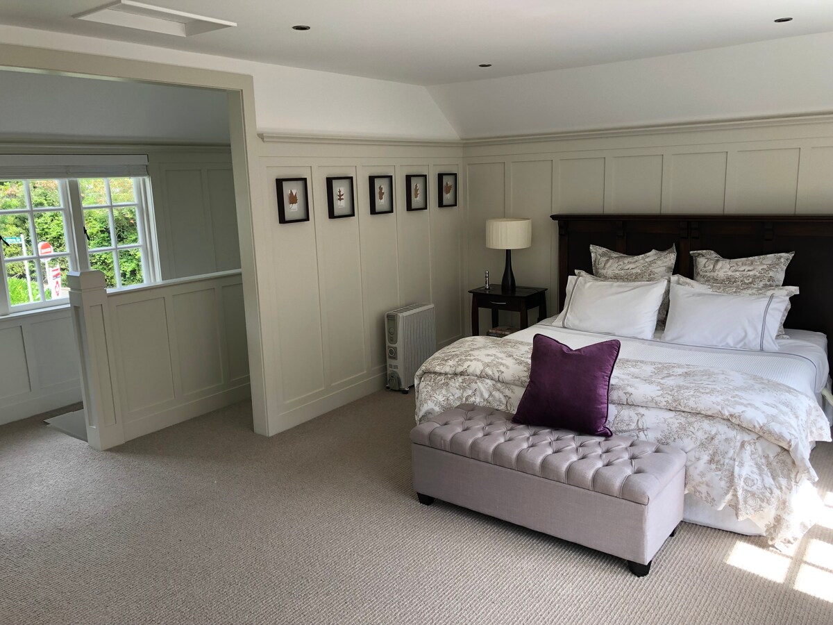 The large sunny bedroom and Super King bed with Wallace Cotton linens.