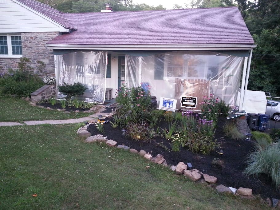 Our place from the front - rain garden on right. The plastic is a rain & snow shield.