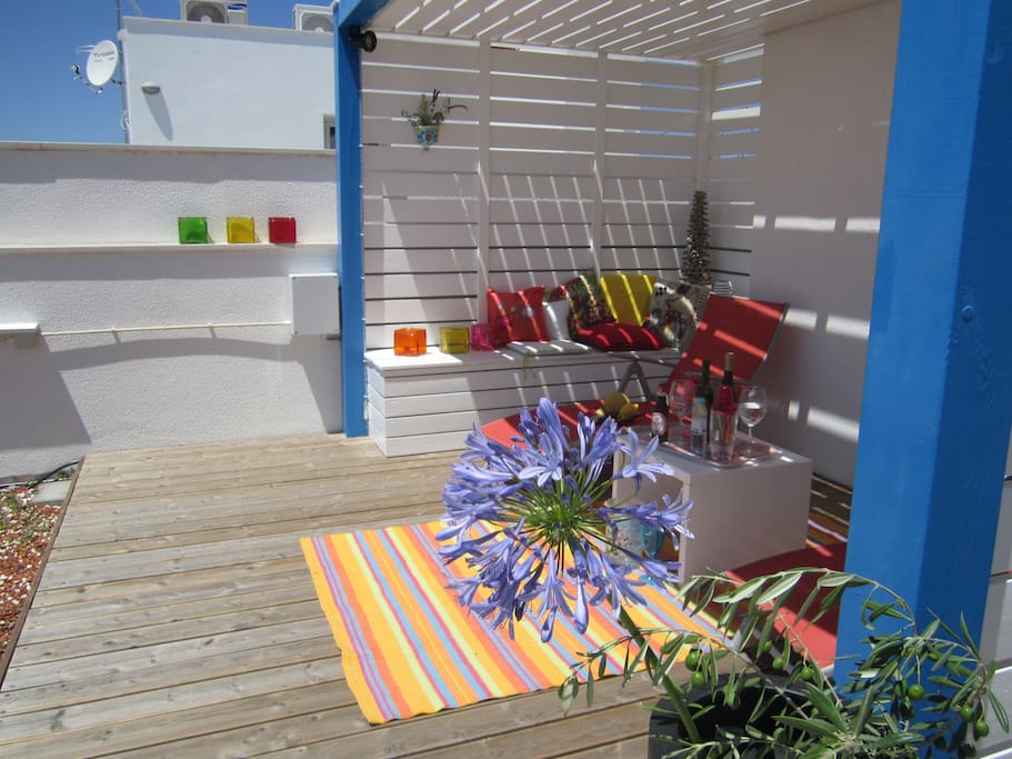 Sunny roof terrace with colourful planting