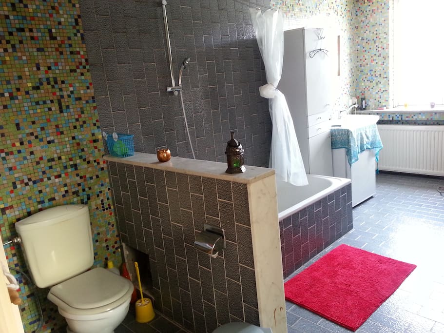 there is a bathtub and shower.