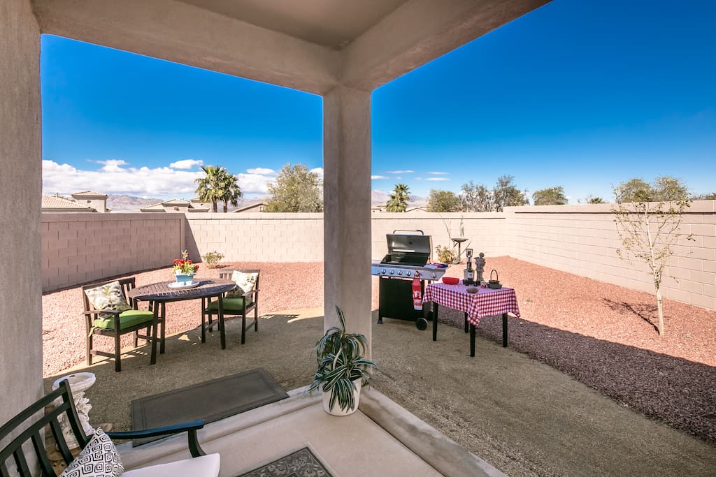 Seating area to dine outside with a BBQ