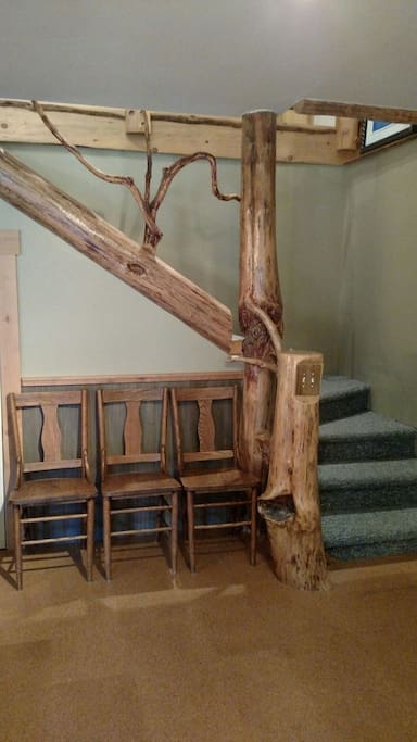 Stairs leading to upstairs bedrooms and bathroom.