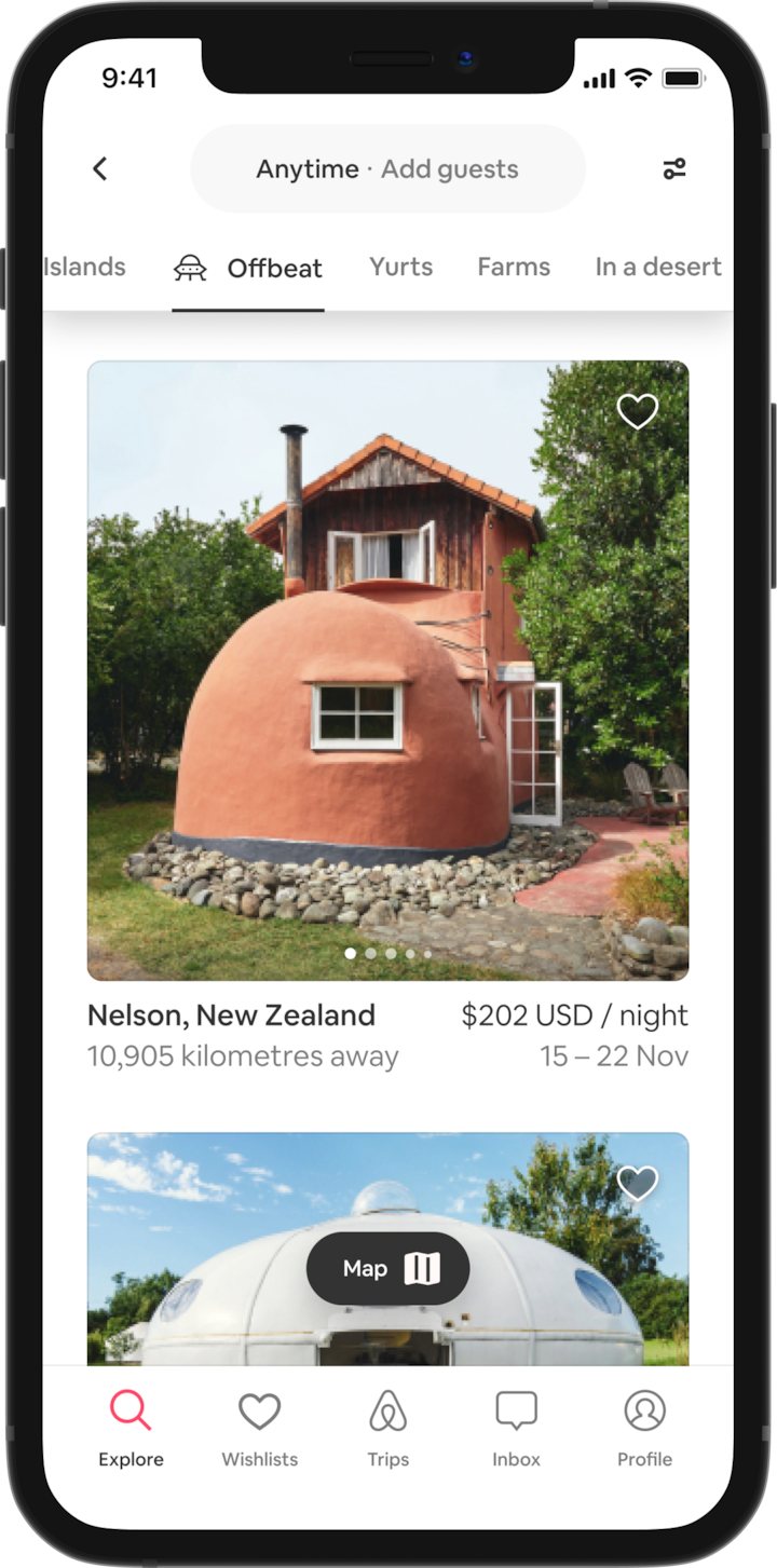 A mobile phone shows a tabbed selection of unique places to stay, like islands, yurts, farms and more. The stays shown are within the new 'offbeat' category, and the first listing shown is a house shaped like a giant boot.