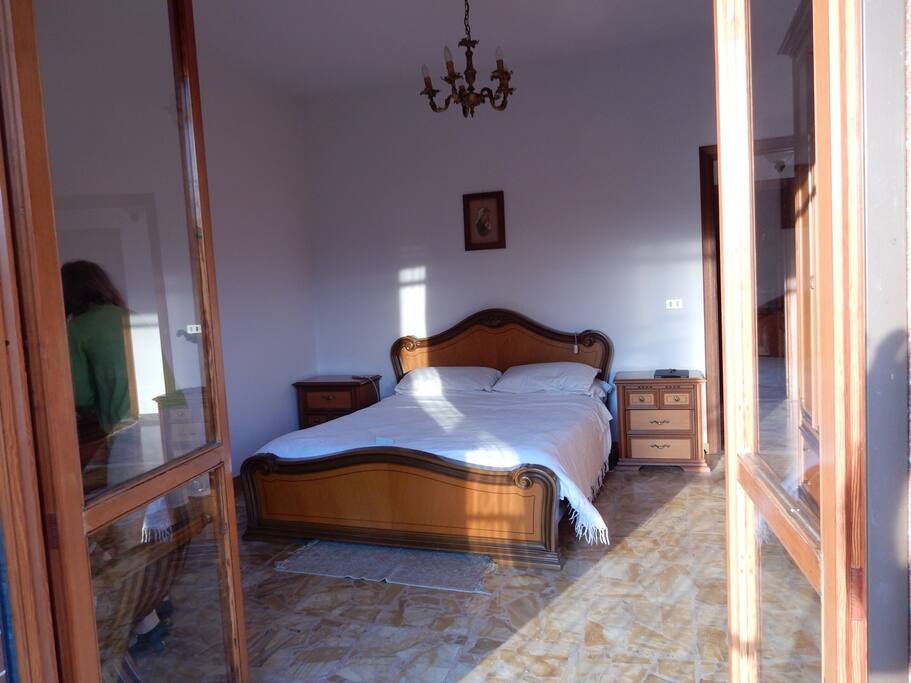 Large roomy bedroom with views