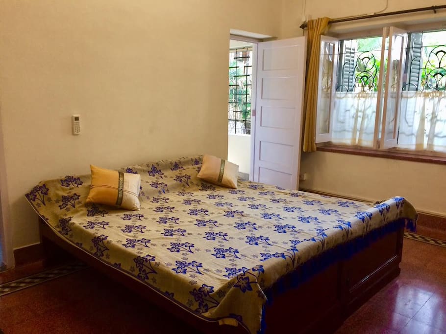 Master bedroom with an attached balcony and toilet