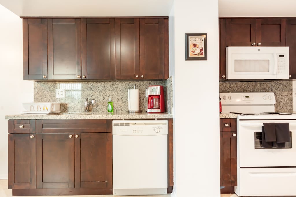 First Floor of Townhouse Granite Kitchen Countertops and Wood Cabinets