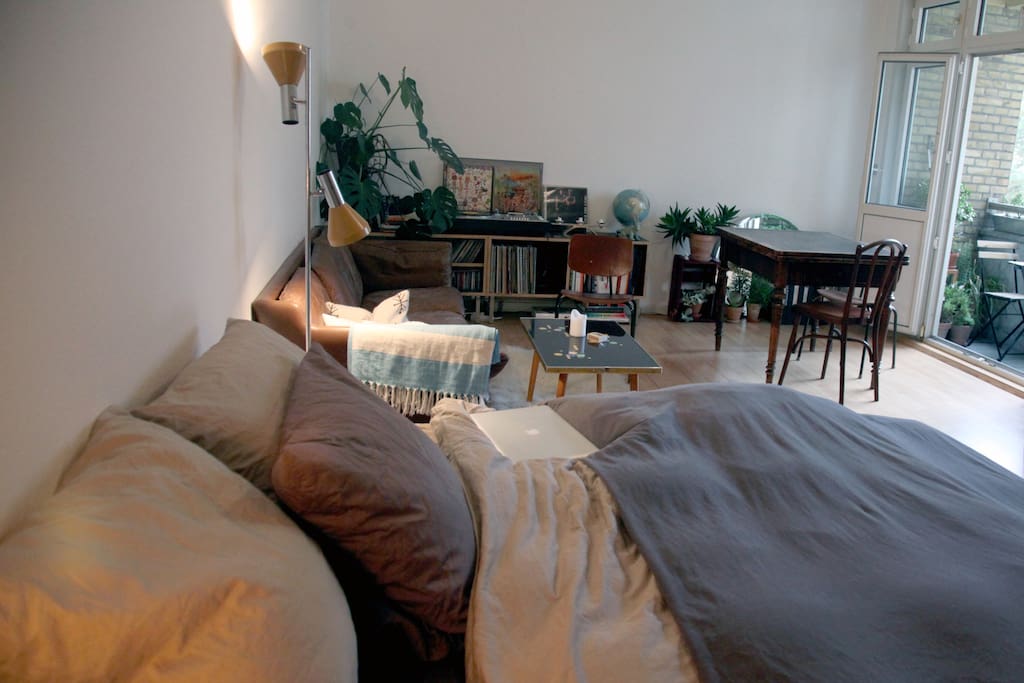 view from bed to balcony with dining table