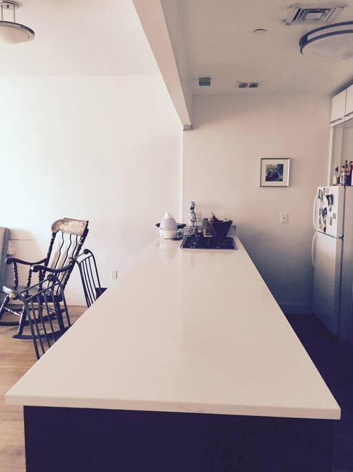 A Shared Kitchen With Stove and Island