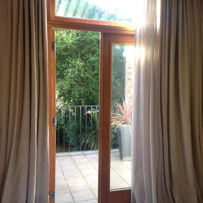 The room opens to a small roof terrace