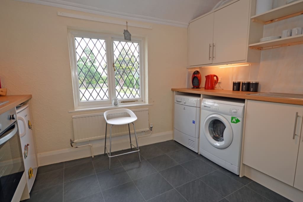Residents kitchen, washing machine & tumble drier facility.