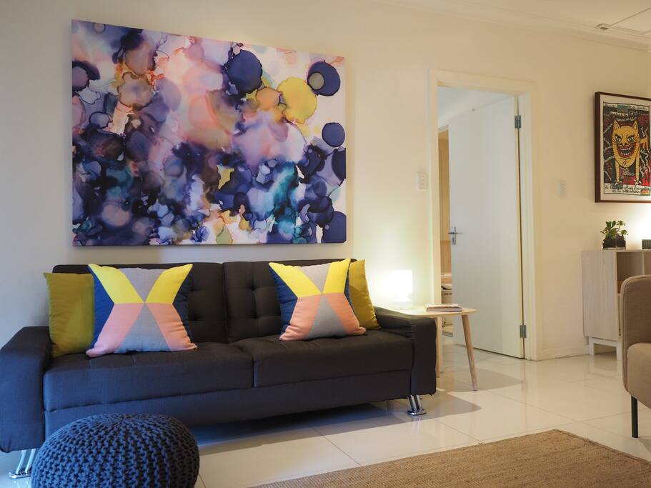 Another view of the lounge room with artwork