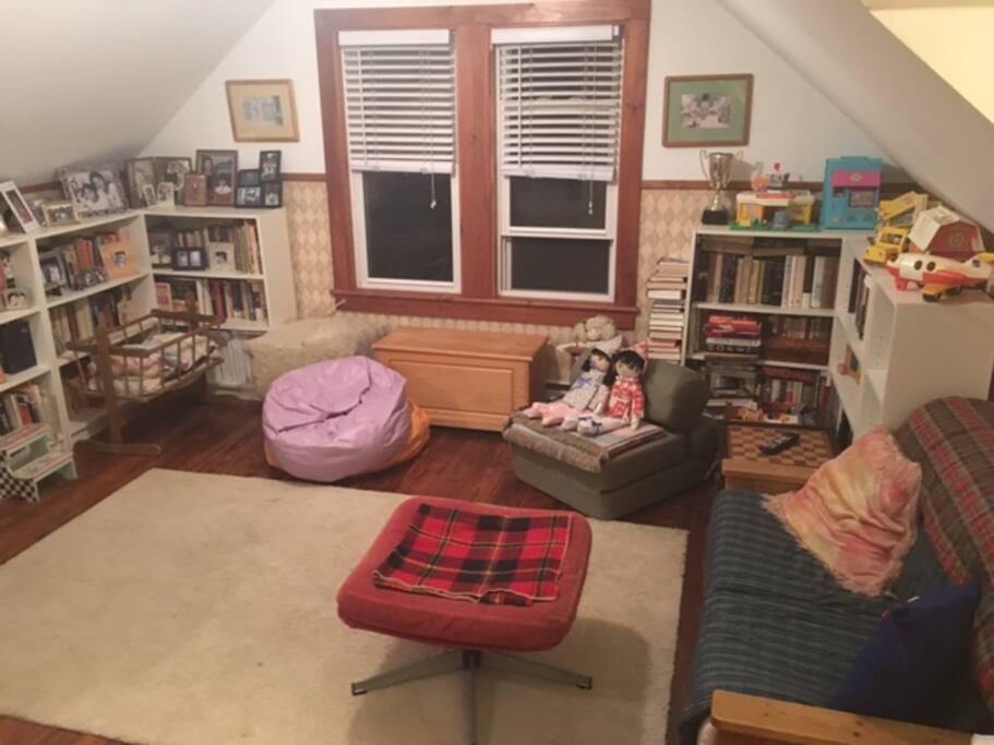 Sitting area with table games, flat screen moniter and double window view of East Mountain