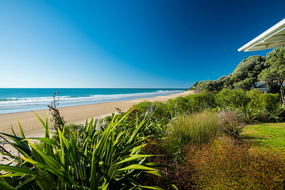A glass beach house on Wainui Beach, Wainui Beach, Gisborne, New Zealand, photo 1 of 10
