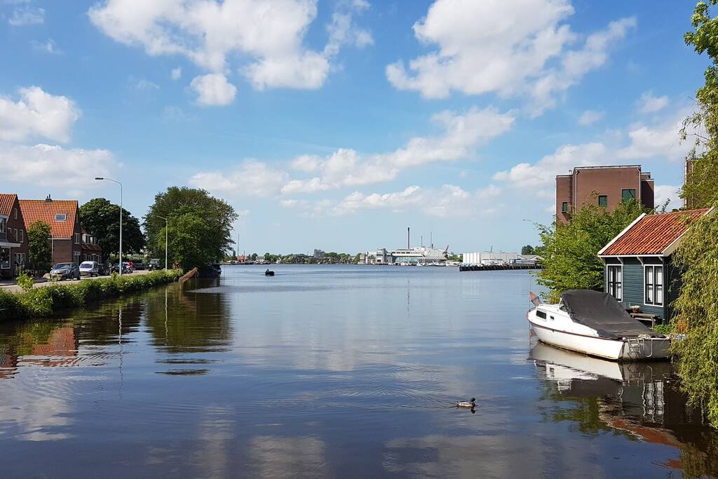 The view, from the bridge, looking over the river "De Zaan".