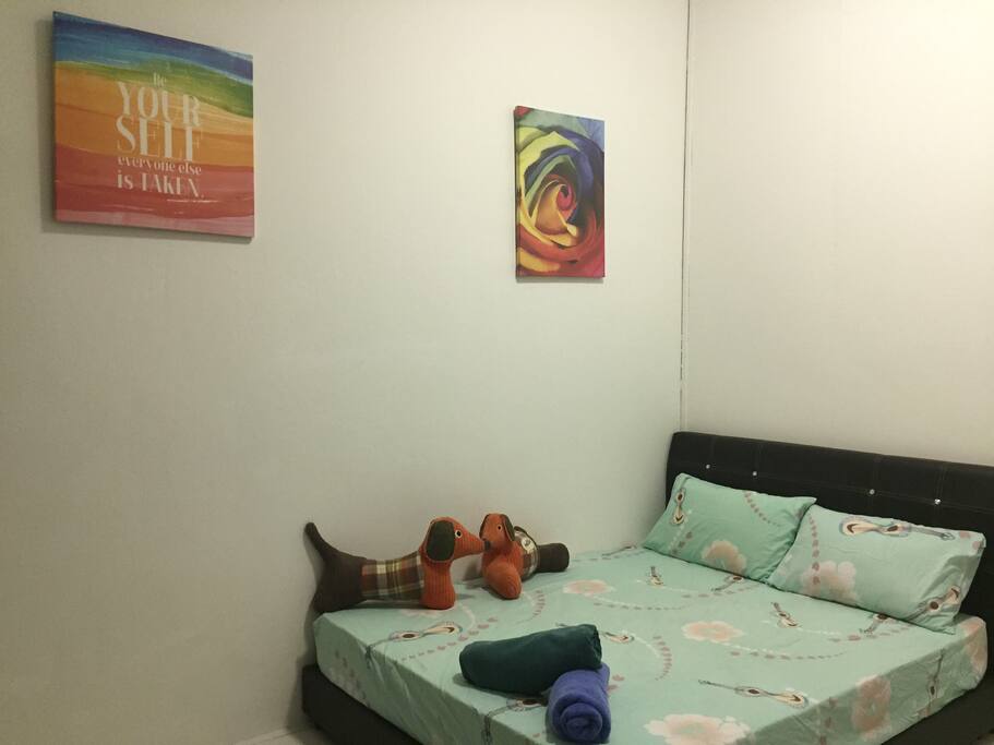 Double bed with painting , but recently have did artwork on the wall , see the artwork photos at the back ..