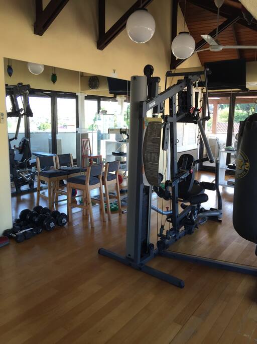 Gym with full length mirrors and windows