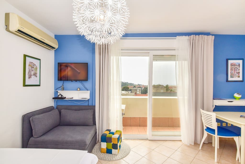 Living room and dining room with balcony