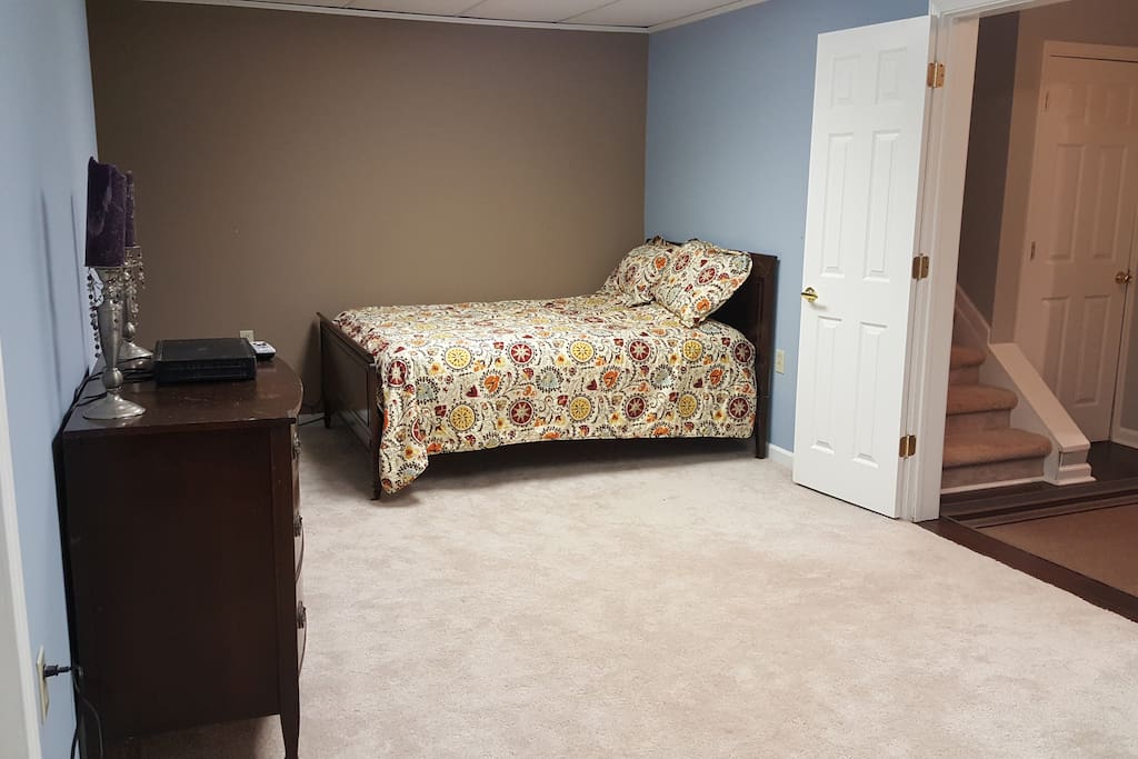 Bedroom with double bed and dresser